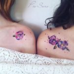 Violet flower tattoo