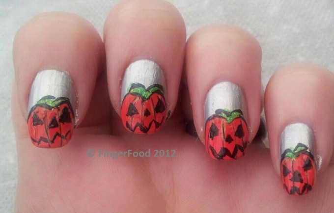 scary spooky pumpkin nail art design idea for halloween