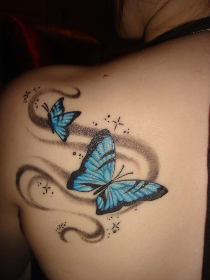 Cute and cool small blue butterflies tattoo