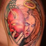 Colorful angel with devil masquerade tattoo