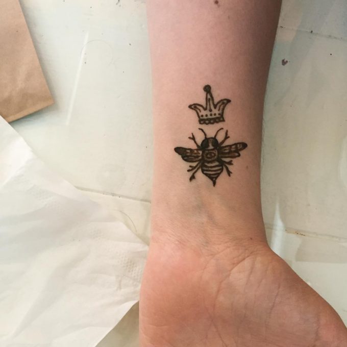 Small wrist bee crown henna design