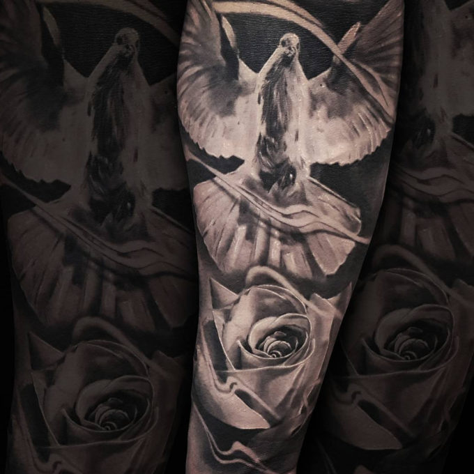 detailed dove with rose tattoo design