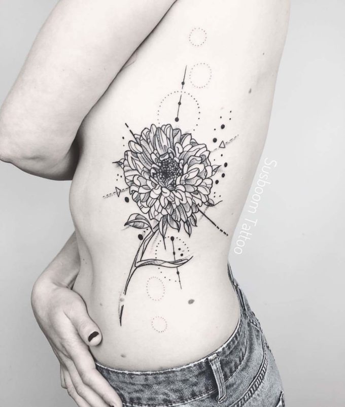 Geometrical Aster Flower Tattoo With Minimal Ink
