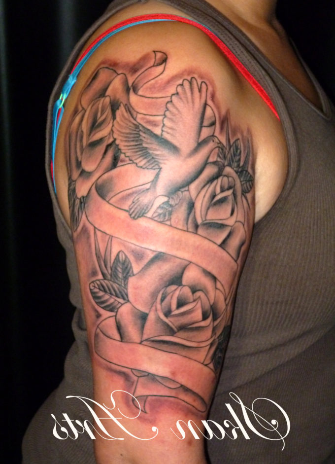 flying dove with roses and ribbon tattoo on sleeve