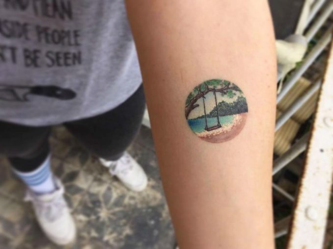 beach and rope swing tattoo picture