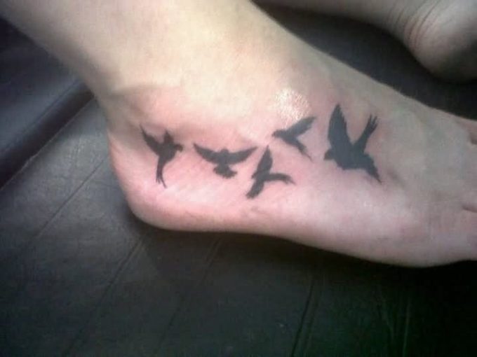 blackbirds tattoo on feet