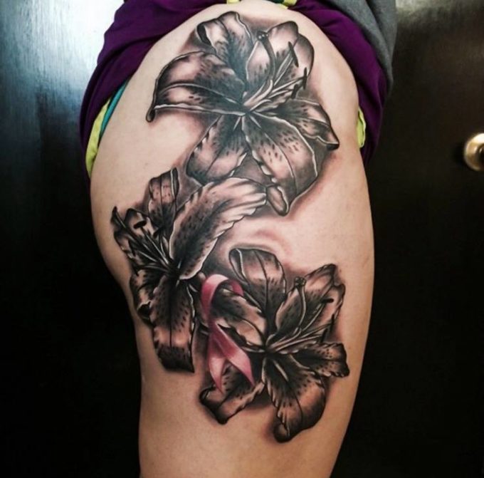 grey tiger lily flowers tattoo on side thigh