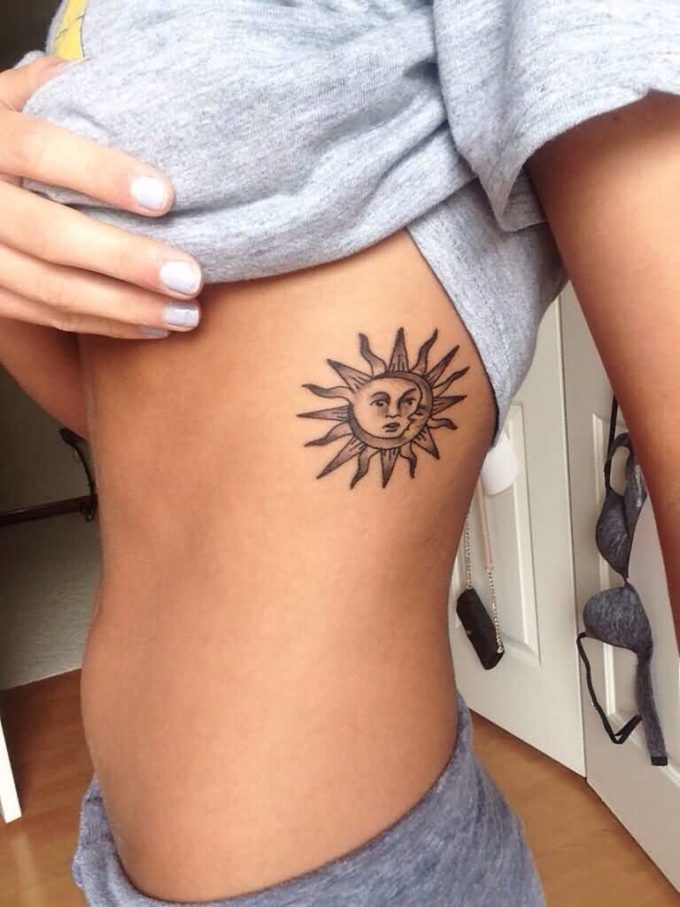 sun and moon tattoo design on ribs
