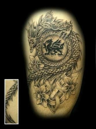 dragon shield with daffodils tattoo for men sleeve