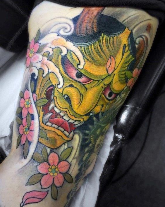 japanese traditional demon mask with cherry blossoms tattoo for men