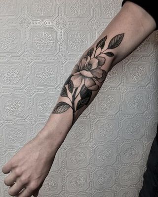 magnolia flower tattoo by Justin Olivier