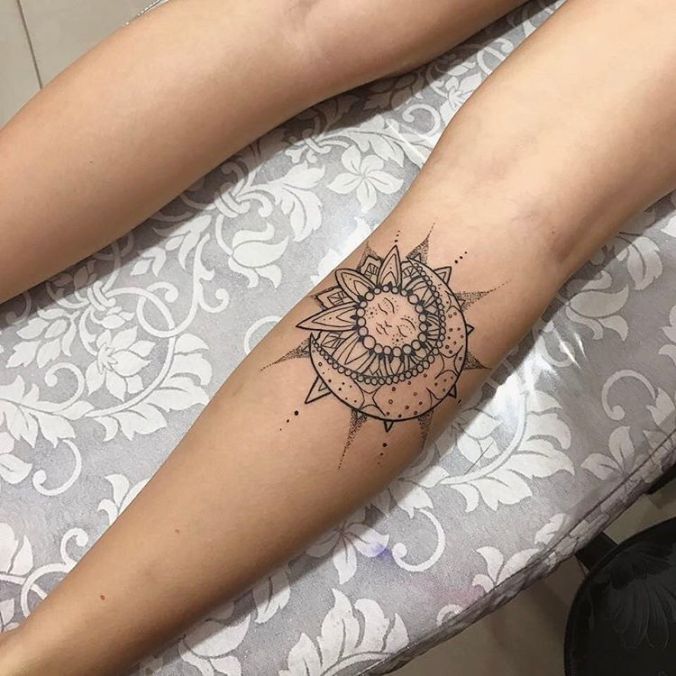 sun and moon tattoo design on shin