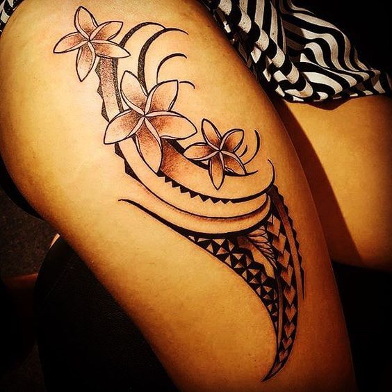 tribal plumeria flower tattoo design on thigh for women