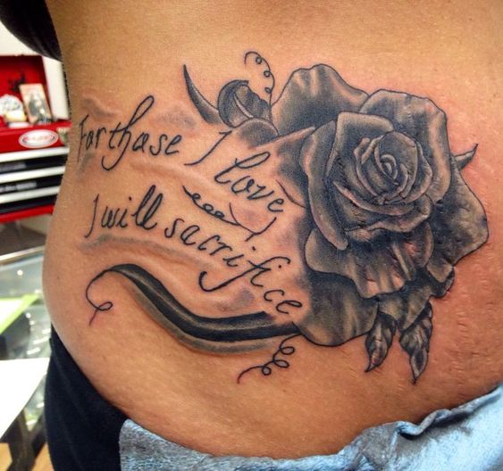 black ink rose flower with quote tattoo to cover stretch marks