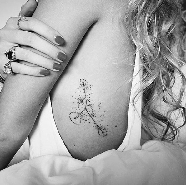 dotwork cancer star constellation tattoo design on ribs for females