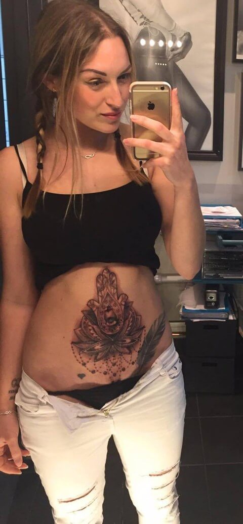 hamsa hand lotus with chandeliers tattoo on stomach to cover up stretch marks