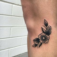 traditional old school flower tattoo on side knee