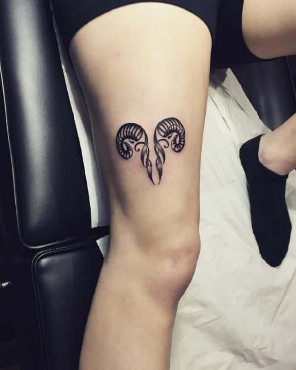 abstract aries zodiac sign tattoo on thigh