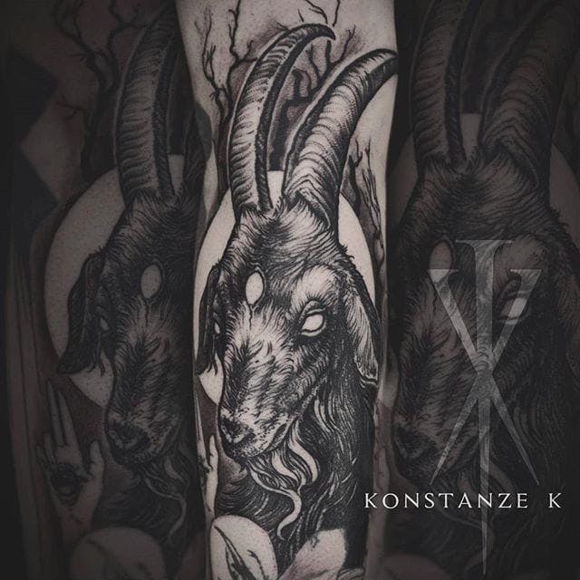 black goat tattoo on arm