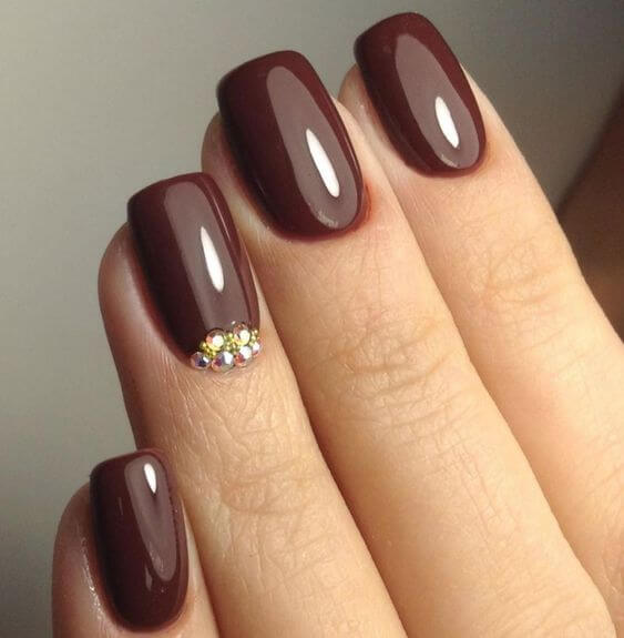 dark chocolate color nails with rhinestones