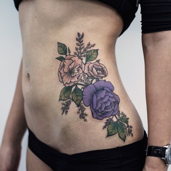 flower tattoos on side stomach for females