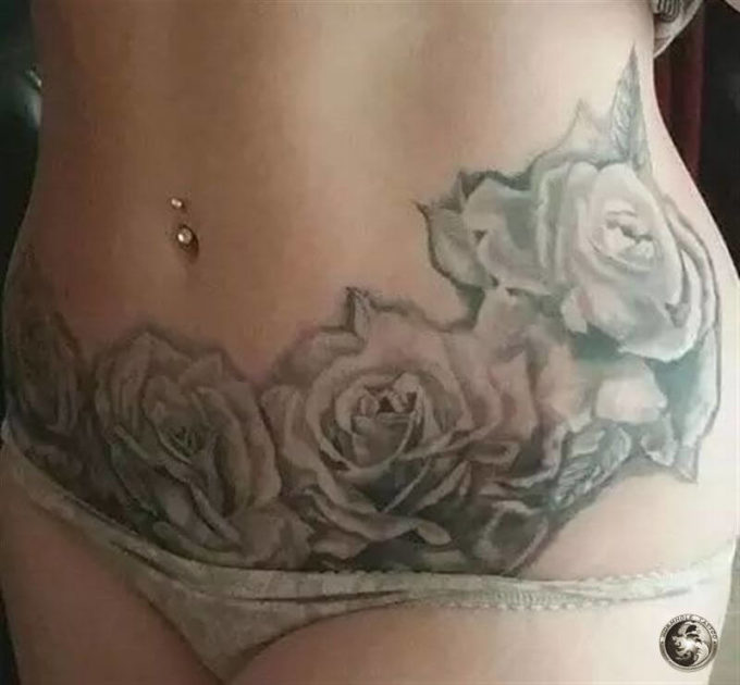 rose flowers tattoo to cover stomach stretch marks