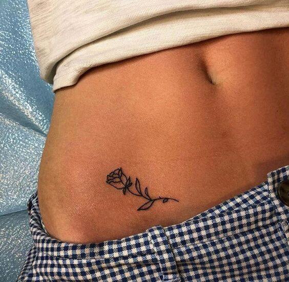 small outline rose flower tattoo on side stomach for girls