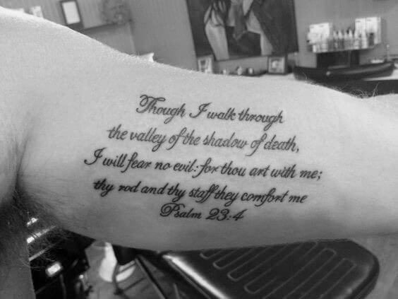 men inner bicep bible script tattoo