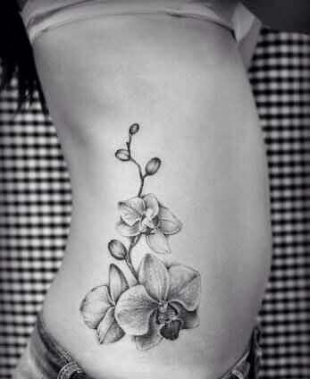gorgeous orchid flower tattoo on side stomach