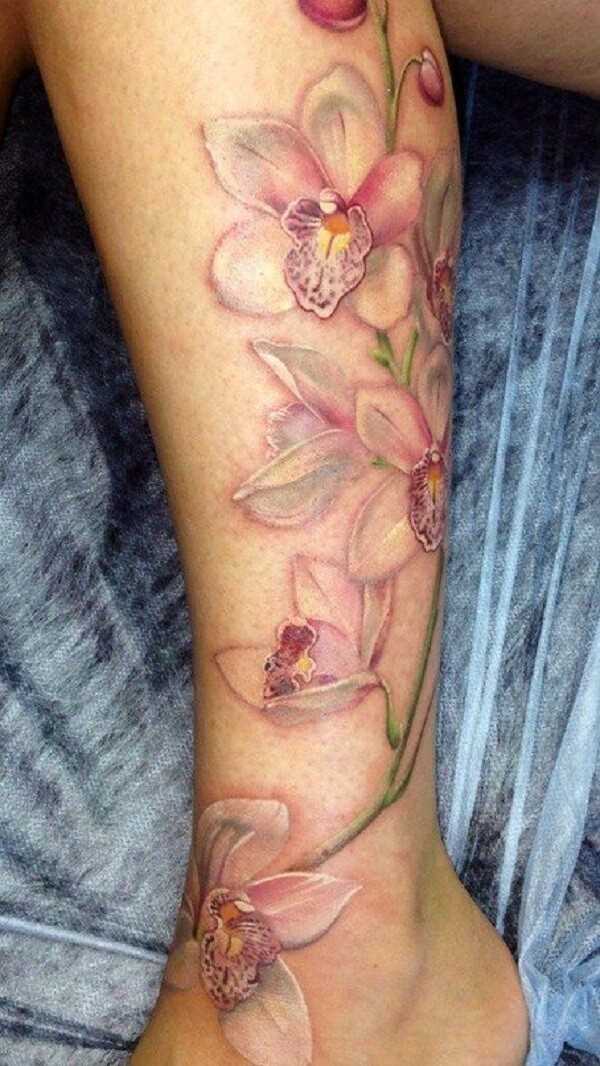 nude orchid flower tattoo design on leg for women