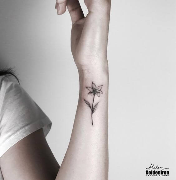 small jasmine tattoo design on side wrist