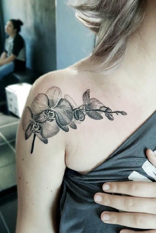 transparent shoulder orchid flower tattoo design