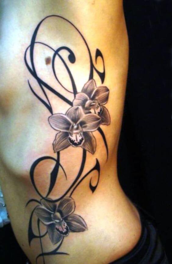 tribal orchid tattoo on side ribs
