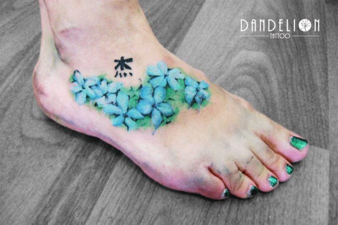 blue jasmine flower tattoo design on foot