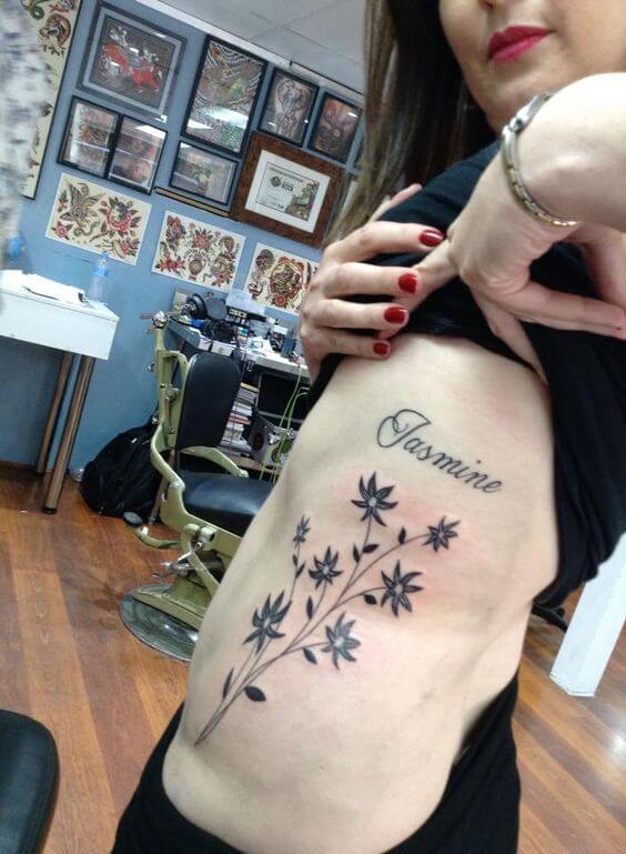 jasmine flowers tattoos on rib cage