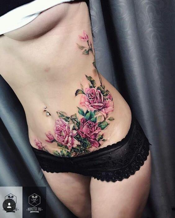 roses and jasmine flowers tattoo design on stomach