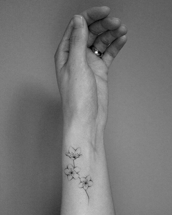 transparent jasmine flower tattoo design on side wrist