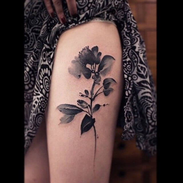 watercolor black jasmine flower tattoo design on thigh