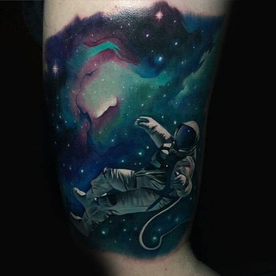 astronaut floating in space tattoo design