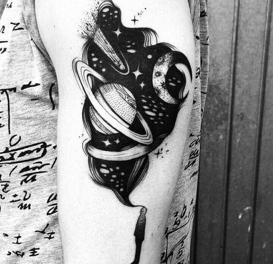 black and white astronomy tattoo idea on upper arm