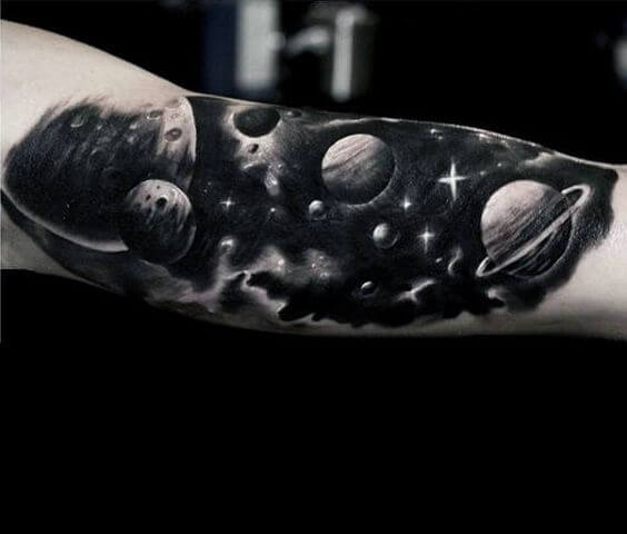black and white astronomy tattoo on arm
