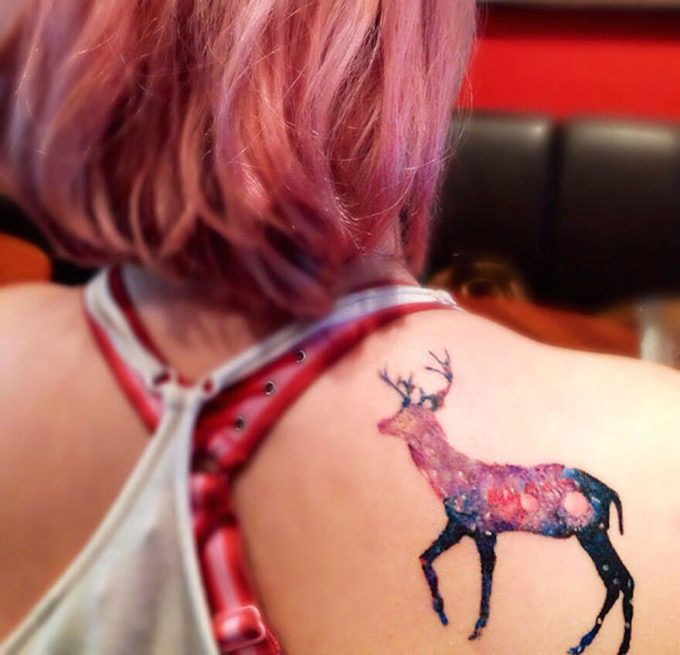 cosmic deer astronomy tattoo design on back shoulder blade