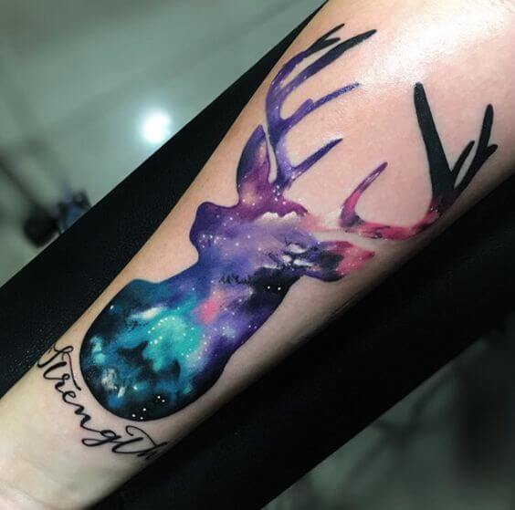 cosmic deer astronomy tattoo design on forearm