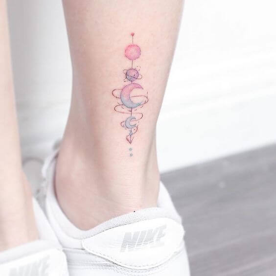 geometric small astronomy tattoo on calf
