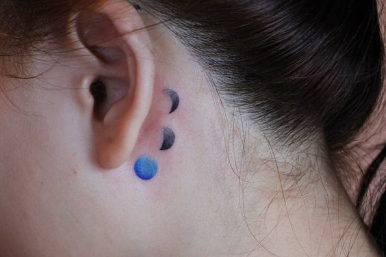 moon phases tattoo idea behind ear