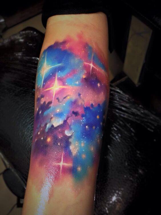 northern lights astronomy tattoo idea on forearm