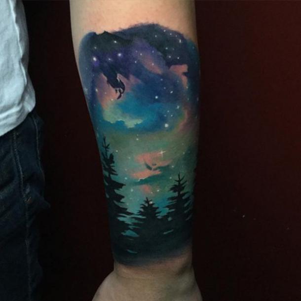 northern lights astronomy tattoo ideas on arm
