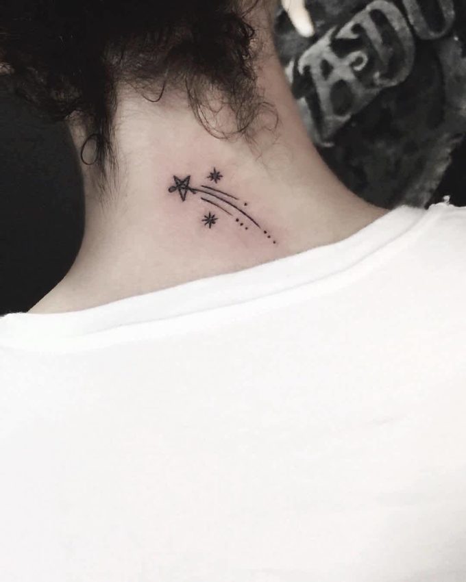 shooting star astronomy tattoo idea on back neck