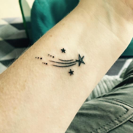 shooting star astronomy tattoo idea on wrist