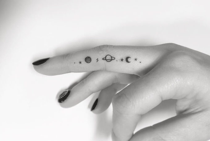 small astronomy tattoo ideas on finger